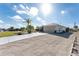 Attached garage with a long paved driveway at 1521 Saint Clair Rd, Englewood, FL 34223