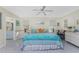 Bright main bedroom with king-size bed and views to the backyard at 1521 Saint Clair Rd, Englewood, FL 34223