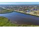 Aerial view of waterfront homes and lush landscape at 15410 Seafoam Cir, Port Charlotte, FL 33981