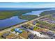 Aerial view of waterfront home and neighborhood at 15410 Seafoam Cir, Port Charlotte, FL 33981