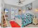 Bright bedroom with a queen bed and access to a private bathroom at 15410 Seafoam Cir, Port Charlotte, FL 33981