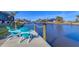 Spacious waterfront dock with seating for two at 15410 Seafoam Cir, Port Charlotte, FL 33981