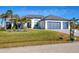 Single-Gathering home with two-car garage and manicured lawn at 15410 Seafoam Cir, Port Charlotte, FL 33981