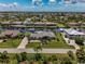 Aerial view of waterfront home on a sunny day at 15794 Viscount Cir, Port Charlotte, FL 33981