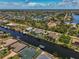 Wide aerial view of canal-front homes and neighborhood at 15794 Viscount Cir, Port Charlotte, FL 33981