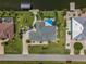 Bird's-eye view of house, pool, and canal at 15794 Viscount Cir, Port Charlotte, FL 33981