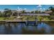 Covered boat lift on a canal with waterfront property at 15794 Viscount Cir, Port Charlotte, FL 33981