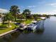 Aerial view of waterfront home with private boat dock at 15794 Viscount Cir, Port Charlotte, FL 33981