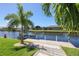 Private dock with boat lift on a tranquil canal at 15794 Viscount Cir, Port Charlotte, FL 33981