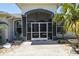 Screened porch with double doors and sidelights at 15794 Viscount Cir, Port Charlotte, FL 33981