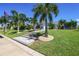 Charming single-story house with palm trees and canal views at 15794 Viscount Cir, Port Charlotte, FL 33981