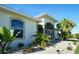 Front entrance of house with landscaping at 15794 Viscount Cir, Port Charlotte, FL 33981