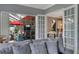 View of living room with french doors opening to a relaxing patio area at 15794 Viscount Cir, Port Charlotte, FL 33981