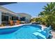 Inviting pool with ample lounge chairs and patio at 15794 Viscount Cir, Port Charlotte, FL 33981