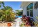 Landscaped side yard with stone pathway at 15794 Viscount Cir, Port Charlotte, FL 33981