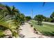 Landscaped walkway leading to house entrance at 15794 Viscount Cir, Port Charlotte, FL 33981