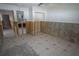 Unfinished kitchen with exposed walls and tiled floor at 1755 Georgia Ne Ave, St Petersburg, FL 33703