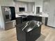 Modern kitchen with dark cabinetry and quartz countertops at 1755 Georgia Ne Ave, St Petersburg, FL 33703