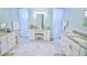 Large bathroom with granite vanity, double sinks and tile floors at 2 Windward Rd, Placida, FL 33946