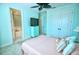 Bedroom with ceiling fan, double doors and ensuite bathroom at 2 Windward Rd, Placida, FL 33946