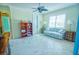 Spacious bedroom with a sofa, shelving unit and large windows at 2 Windward Rd, Placida, FL 33946