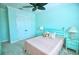 Bedroom with ceiling fan, double doors and light color scheme at 2 Windward Rd, Placida, FL 33946