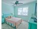 Light and airy bedroom with a double bed, nightstands, and a ceiling fan at 2 Windward Rd, Placida, FL 33946