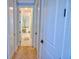 Light hallway with carpeted floors and access to bedrooms at 2 Windward Rd, Placida, FL 33946