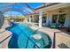 Stunning pool and spa with covered lanai and outdoor seating at 2 Windward Rd, Placida, FL 33946