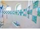 Walk-in shower with patterned tile and built-in seat at 2 Windward Rd, Placida, FL 33946