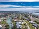 Bird's-eye view of waterfront property and neighborhood at 210 Capstan Dr, Placida, FL 33946