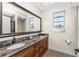 Elegant bathroom with double vanity and granite countertop at 210 Capstan Dr, Placida, FL 33946