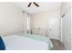 Bedroom with king-size bed, dresser and ceiling fan at 210 Capstan Dr, Placida, FL 33946