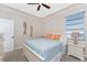 Guest bedroom with light blue bedding and coastal decor at 210 Capstan Dr, Placida, FL 33946