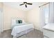 King-size bed in a well-lit bedroom with ceiling fan at 210 Capstan Dr, Placida, FL 33946