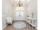 Bright and airy entryway, featuring a round rug and white console table at 210 Capstan Dr, Placida, FL 33946