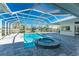 Enclosed pool and spa with paver deck at 210 Capstan Dr, Placida, FL 33946