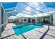 Enclosed pool and spa with paver deck at 210 Capstan Dr, Placida, FL 33946