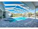 Enclosed pool and spa with paver deck at 210 Capstan Dr, Placida, FL 33946