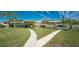 Landscaped walkways leading to the waterfront at 210 Capstan Dr, Placida, FL 33946