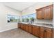 Spacious wet bar featuring granite countertops and ample cabinetry at 210 Capstan Dr, Placida, FL 33946