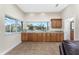 Wet bar with granite countertops and wood cabinets at 210 Capstan Dr, Placida, FL 33946