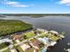 Aerial view of waterfront property with canal access and lush landscaping at 2295 Chilcote Ter, Port Charlotte, FL 33981