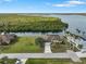 Aerial view of waterfront home with private pool and lush landscaping at 2295 Chilcote Ter, Port Charlotte, FL 33981