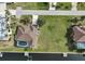 Aerial view of waterfront property with pool and canal access at 2295 Chilcote Ter, Port Charlotte, FL 33981