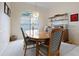 Elegant dining room with oval table and six chairs at 2295 Chilcote Ter, Port Charlotte, FL 33981