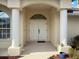 Elegant entryway with double doors and decorative columns at 2295 Chilcote Ter, Port Charlotte, FL 33981