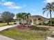 Single story home with attached garage and mature landscaping at 2295 Chilcote Ter, Port Charlotte, FL 33981