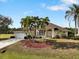 Single story home with attached garage and tropical landscaping at 2295 Chilcote Ter, Port Charlotte, FL 33981