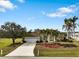 Single-story house with a two-car garage and lush landscaping at 2295 Chilcote Ter, Port Charlotte, FL 33981